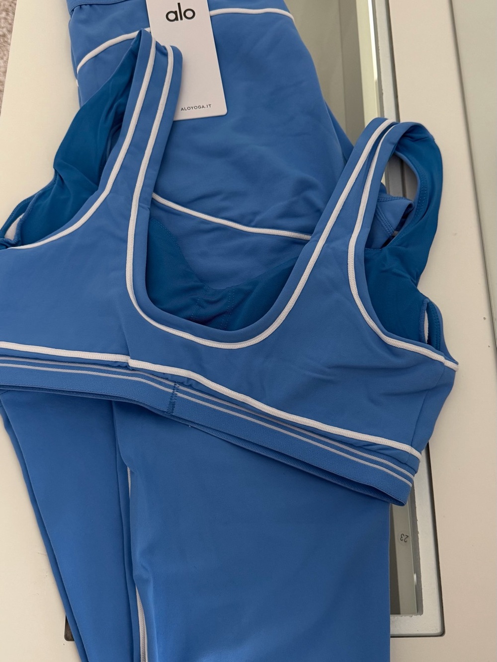ALO Yoga Blue Sports Bra with White Piping